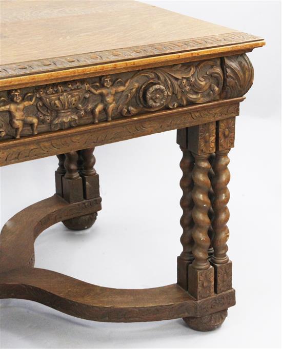 A 17th century style Flemish carved oak library table, W.6ft